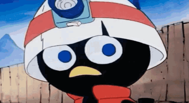 a black cartoon character wearing a helmet and scarf with a camera on his head .