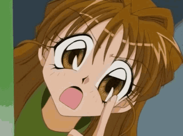 a close up of a cartoon girl 's face with a surprised expression on her face