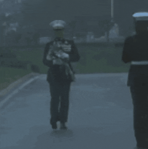 a man in a military uniform has a medal around his neck that says ' u.s. marines '