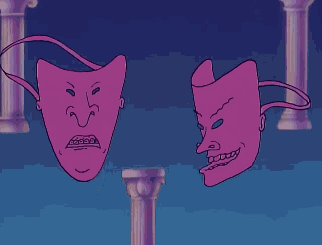 two pink masks are standing next to each other on a pillar