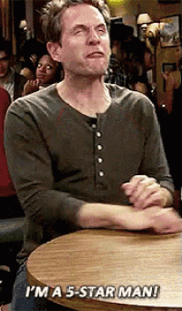 a man sitting at a table says i 'm a 5-star man