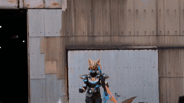 a person in a mask is standing in front of a metal wall