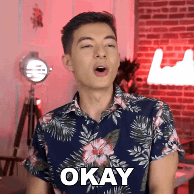 a man in a floral shirt says okay