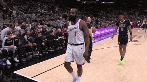 a basketball player with the number 1 on his jersey stands on the court