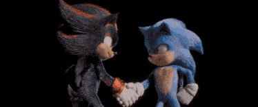 shadow the hedgehog and sonic the hedgehog are shaking hands .