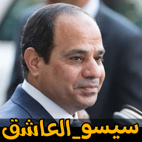 a close up of a man 's face with arabic writing on it