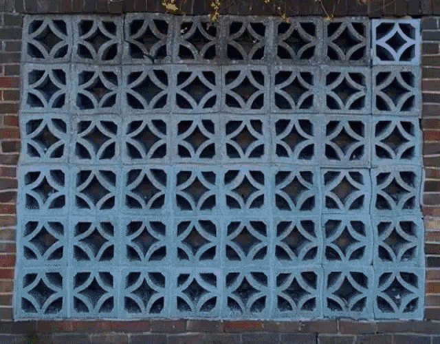 a brick wall with a pattern of bricks that looks like a grid