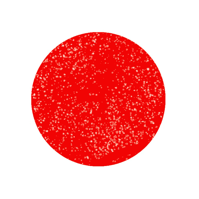 a red circle with white glitter on it