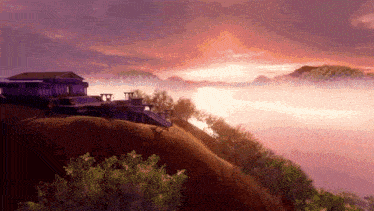 a house sits on a hill overlooking a body of water at sunset