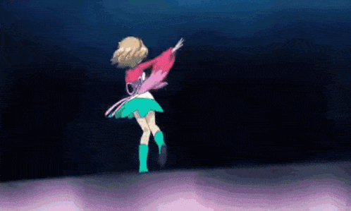 a girl in a red jacket and green skirt is dancing on a stage .