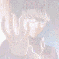 a close up of a person 's hand reaching out in front of their face .
