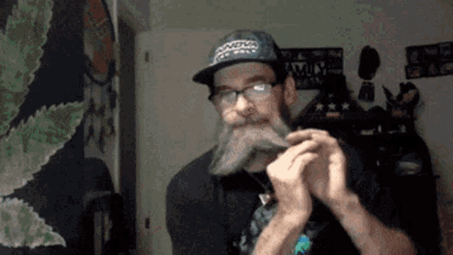 a man with a beard wearing glasses and a hat that says always on it