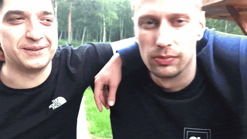 a man wearing a black shirt with the north face on it
