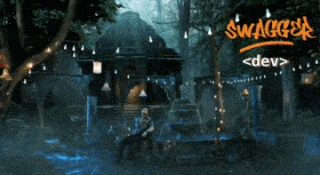 a man in a suit stands in front of a fountain that says swagger < dev > on the bottom