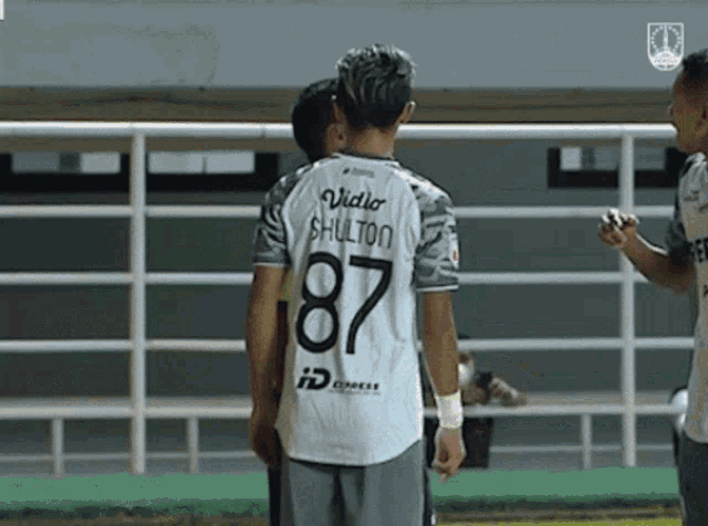 a soccer player with the number 87 on their jersey