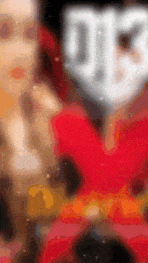 a blurred image of a person wearing a mask with the letter m on the face