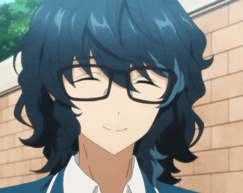a boy with long blue hair and glasses is smiling