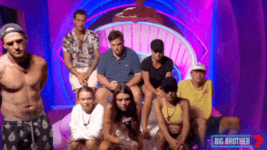 a group of people in front of a big brother sign