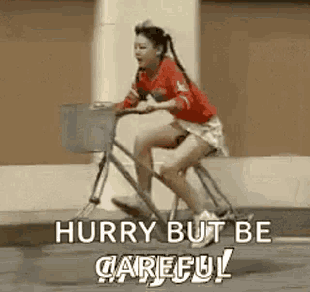 a woman is riding a bike on a sidewalk with a basket .