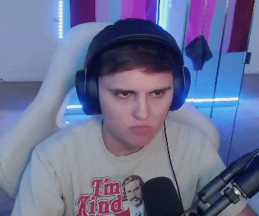 a man wearing headphones and a shirt that says " i 'm kind "