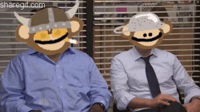 a monkey wearing a viking helmet is smoking a cigarette next to another man