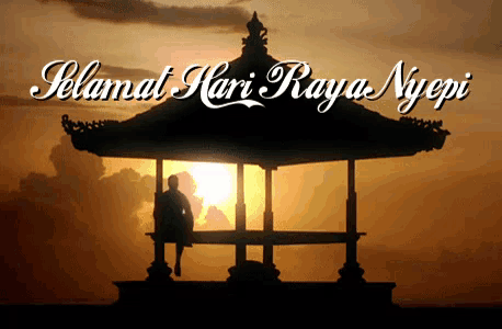 a man sits under a gazebo with the words selamat hari raya nyepi written above him