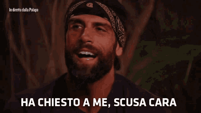 a man with a bandana on his head says " ha chiesto a me scusa cara "