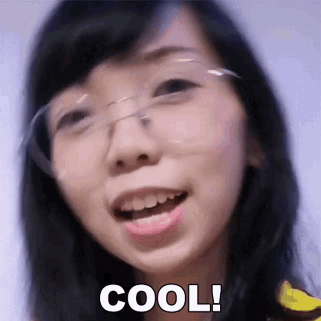 a close up of a woman wearing glasses with the word cool on her face