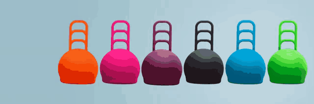a row of colorful balls with handles on them