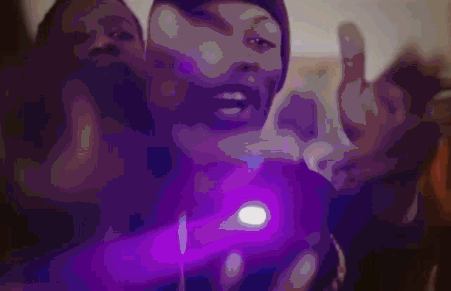 a man and a woman are making a peace sign with their hands