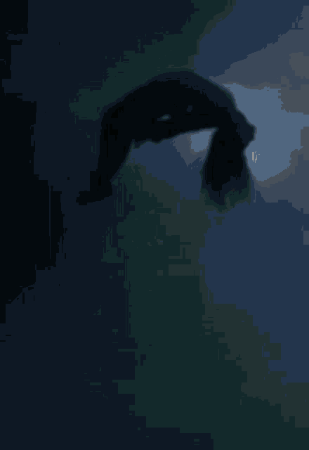 a silhouette of a woman doing a handstand in the dark