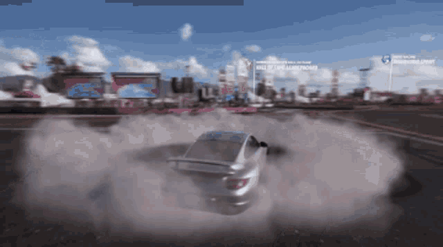 a car is drifting in front of a sign that says " hall of the american "