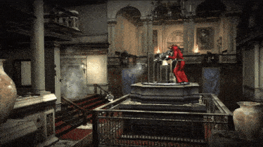 a statue of a man in a red robe is standing in a room