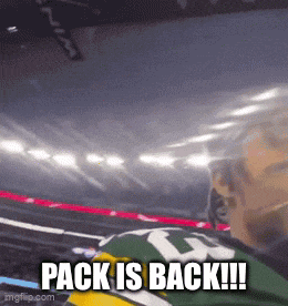 a man in a green and yellow jersey says pack is back