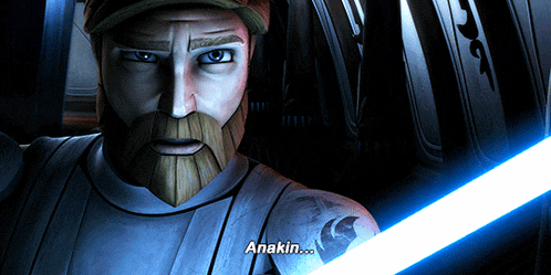 a man with a beard is holding a light saber and the word anakin is above him