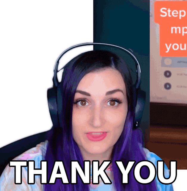 a woman with purple hair is wearing headphones and says " thank you "