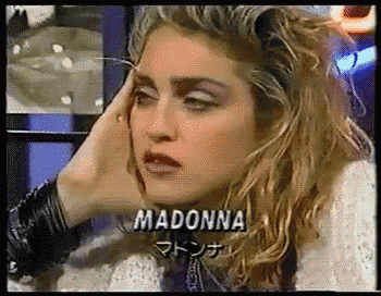 a close up of a woman 's face with the word madonna on the bottom