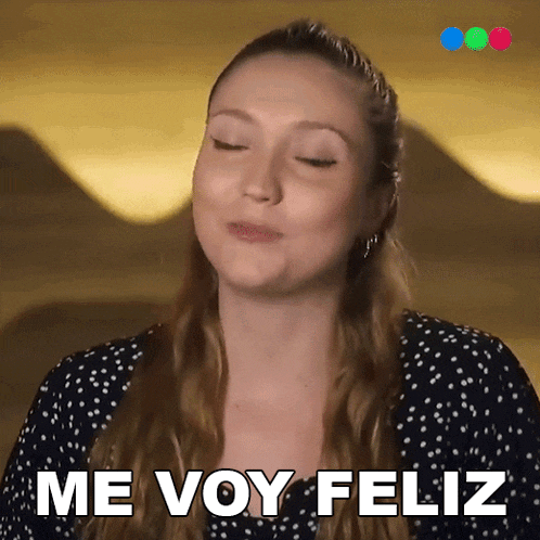 a woman says me voy feliz in a polka dot dress