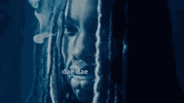 a close up of a woman 's face with the words dae dae visible
