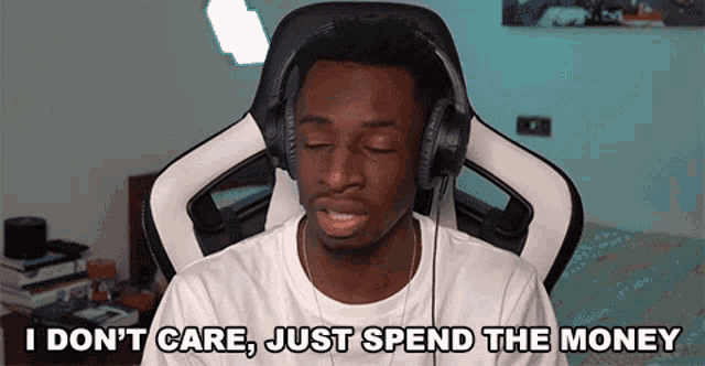 a man wearing headphones is sitting in a chair and saying " i don 't care just spend the money "