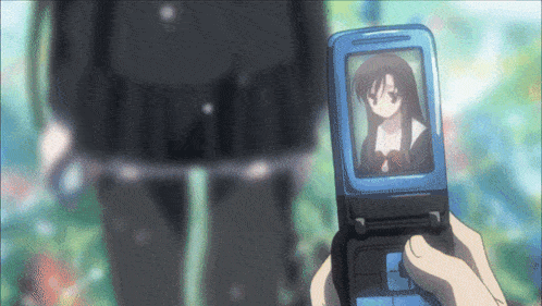 a person is holding a cellphone with a picture of a girl on it