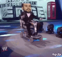 a man in a suit is riding a mobility scooter