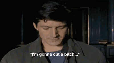 a man is saying " i 'm gonna cut a bitch " in a dark room