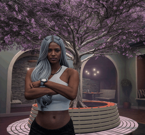 a woman wearing a watch stands in front of a tree