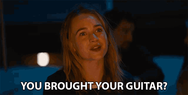 a woman says " you brought your guitar " in front of her