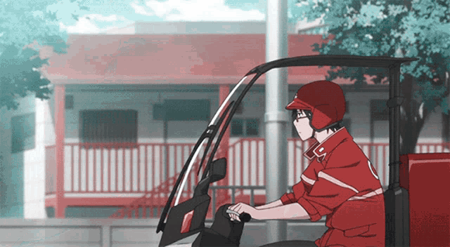 a man in a red jacket and helmet is driving a red vehicle