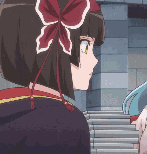 a girl with a red bow on her head stands next to a girl with blue hair