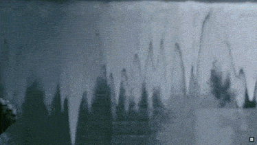 a black and white image of icicles hanging from a ceiling