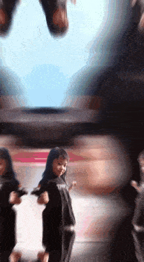 a girl with blue hair is wearing a black shirt that says tmt