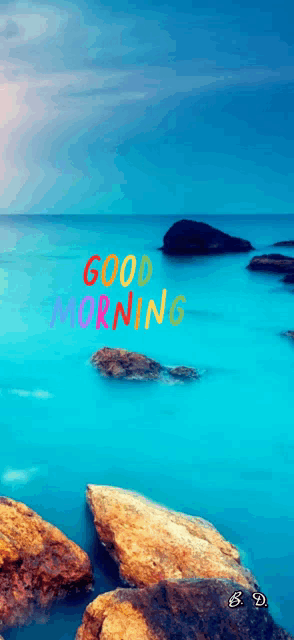 a picture of the ocean with the words " good morning " written on it